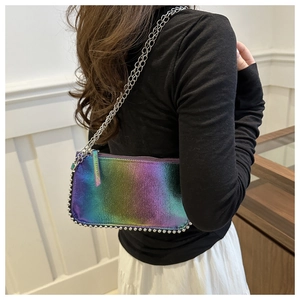 Close-up of iridescent gradient chain bag with metallic shimmer and silver beaded trim