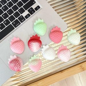 3D resin strawberry phone grip holders in various pink and red gradient colors