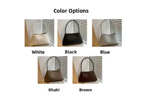 Detail showing the woven texture of the shoulder bag in white, black, blue, khaki and brown