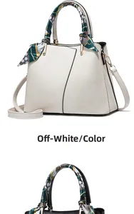 Off-white lychee leather handbag with silk scarf detail and golden metal hardware