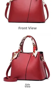 Detailed view of a red pebble leather handbag with a floral silk scarf wrapped handle