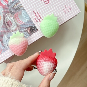 Close-up of cute 3D strawberry phone socket holders with realistic seed texture