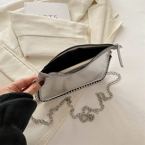 Silver metallic envelope chain bag with rivet trim and spacious interior for phone