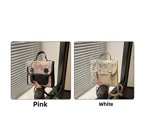 Detail of sweet Lolita style backpacks with lace trim and pearl bow charms in pink and white