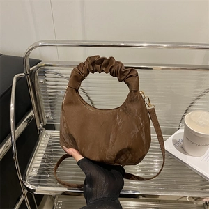 Brown vintage hobo bag with pleated handle and polished texture for casual daily fashion