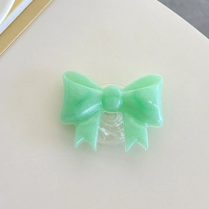 Detail of mint green resin ribbon phone socket with a sparkling pearlescent finish