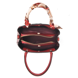 Red minimalist faux leather handbag with silk scarf handle and multi-compartment interior