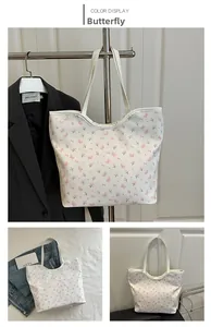 Detail view of large white floral tote bag with pink butterfly prints in various setups