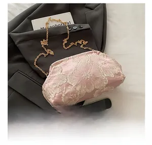 Detailed embroidery on pink satin fabric of the chic Chinese style evening clutch bag