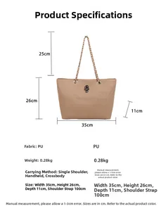 Detailed view of beige tote bag with embossed skull patterns and metal skull charm