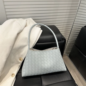 Light blue woven leather baguette bag with Intrecciato pattern for elegant daily use