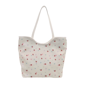 White floral tote bag with strawberry prints and long shoulder strap for daily use