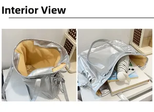 Vue intérieure du sac fourre-tout argenté montrant sa grande capacité pour livres et parapluie