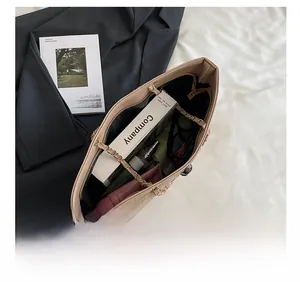 Top view showing the spacious interior of an apricot quilted tote bag for commuting