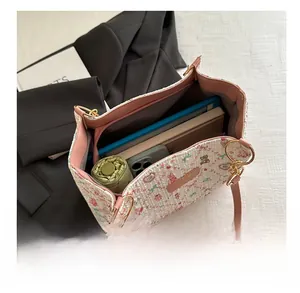 Spacious tote interior showing space for tablet, umbrella, and daily items