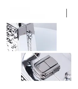 Close-up of polished silver acrylic clutch metal clasp and chain ring attachments
