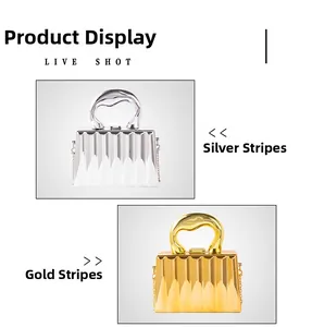 Detailed comparison of gold and silver acrylic evening bags with vertical stripe texture