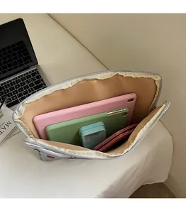 Silver cherry print storage bag showing spacious interior with two tablets and notebooks