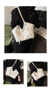 Detail of glossy beige tote bag featuring adjustable buckle straps and polished finish