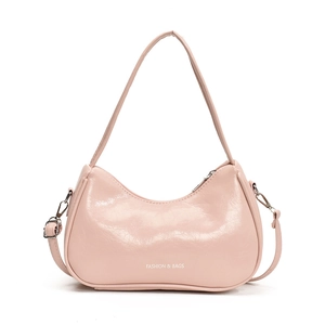 Pink crescent underarm bag in glossy leather with adjustable strap and front lettering