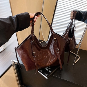 Retro coffee brown glossy tote bag with crinkled texture and adjustable silver buckles