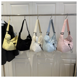 Detailed look at five colors of nylon crescent crossbody bags with small round pouches