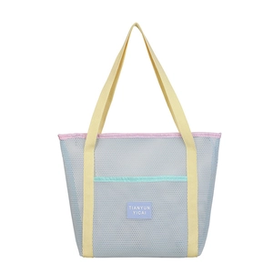 Large mesh beach tote bag with colorful handles and spacious summer storage capacity