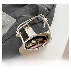 Top-down macro view showing the spacious interior capacity of this cream hobo bag