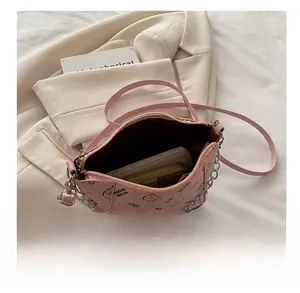 Pink PU bucket bag interior capacity showing space for a smartphone and long wallet