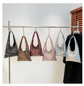 Detail view of the hobo bag collection featuring metallic eyelet rivets in six distinct colors