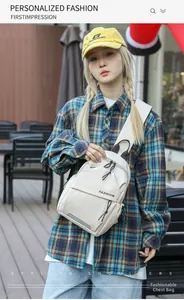 Close-up of off-white sling bag with FASHION lettering and reflective safety strip
