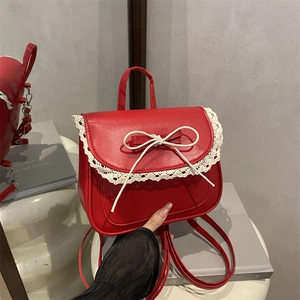 Red kawaii lace backpack with white bow and lace trim details for sweet fashion look