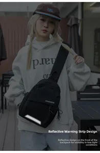 Detail of black sling bag with reflective stripe and fashion text for night safety