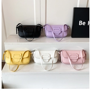 Group photo of five colorful minimalist leather baguette bags on geometric white steps