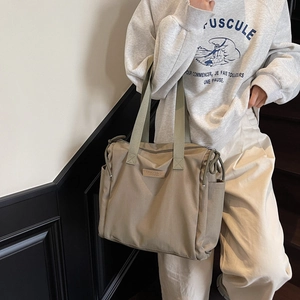 Large khaki nylon tote bag with olive green straps for stylish daily commuting wear