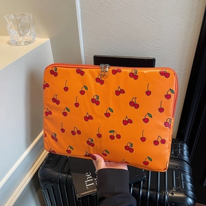Orange laptop sleeve with cherry print for 13-14 inch devices and zipper closure