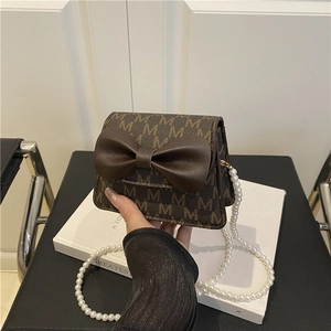 Retro mini crossbody bag with dark brown monogram pattern and elegant pearl chain strap