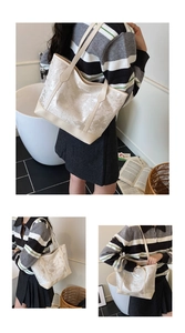 Close-up of off-white tote bag featuring delicate butterfly floral patterns and glossy finish