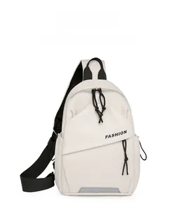 Detail of off-white chest bag featuring FASHION print and black adjustable strap