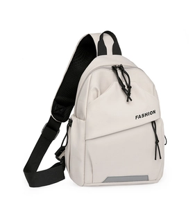 Detail of beige fashion chest bag with nylon strap, reflective strip and logo print