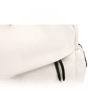 Detail shot of white canvas chest bag featuring bold black FASHION text and woven drawstring