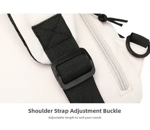 Detail view of the adjustable shoulder strap buckle on the white canvas chest bag