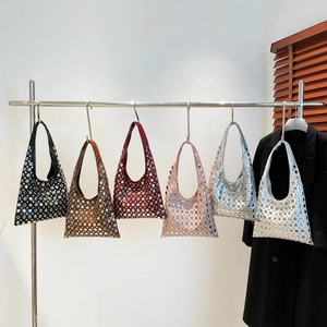 Chic rivet bucket bags in six colors displayed on a rack for a modern urban fashion look