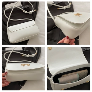 Vues détaillées du sac bandoulière en cuir blanc avec nœud doré et espace interne