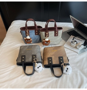 Flat lay of bucket bags in denim, green, grey, mocha with cute monster charms