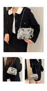 Detailed view of silver sequin texture and metallic chain strap on this elegant party bag