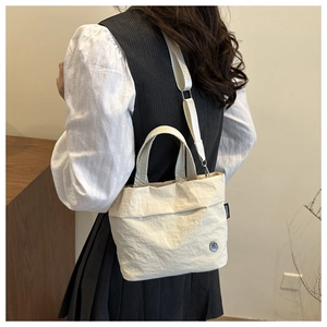 Borsa a tracolla minimalista in tela crema da donna con cinturino regolabile