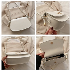 Detail of white leather crossbody bag with golden bow buckle and internal phone space