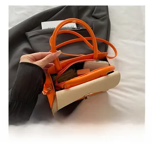 Interior view showing capacity of the contrast color crossbody bag with daily items