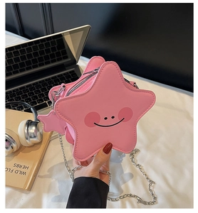 Pink star-shaped crossbody bag with a cute smiley face and silver chain strap detail